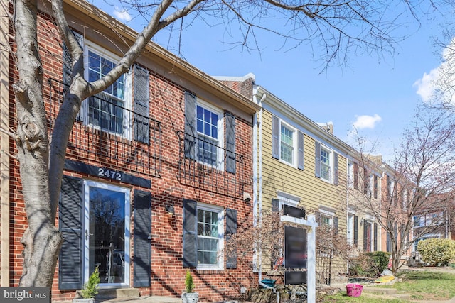 view of front of home with brick siding