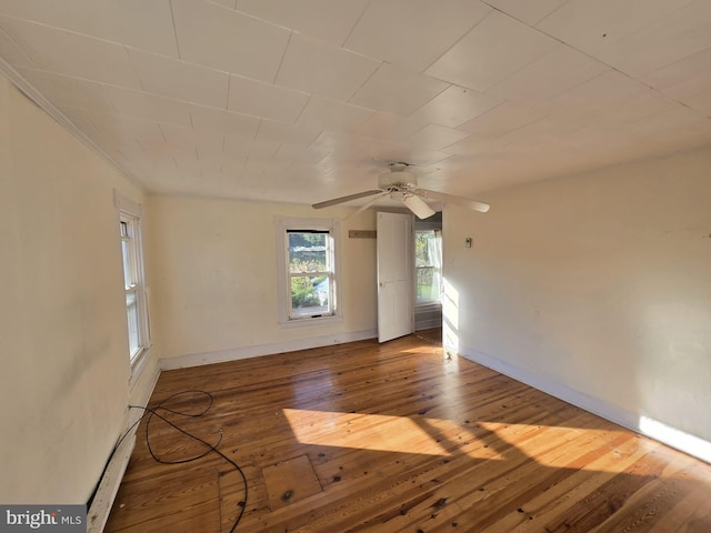 unfurnished room with hardwood / wood-style flooring and ceiling fan