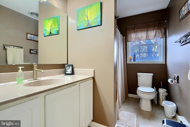 bathroom with toilet, baseboards, visible vents, and vanity