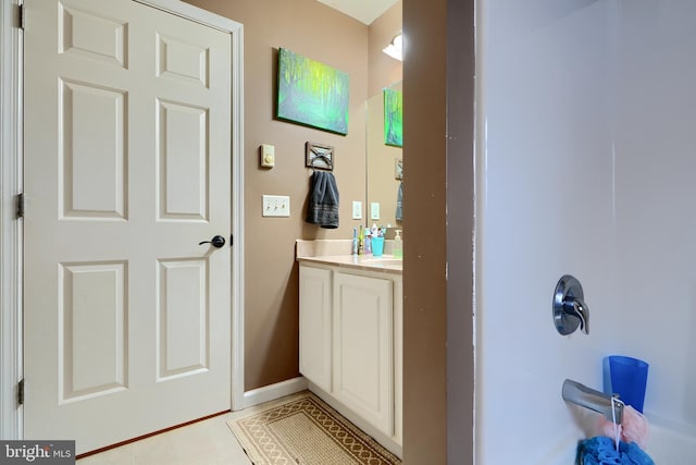 bathroom featuring baseboards and vanity