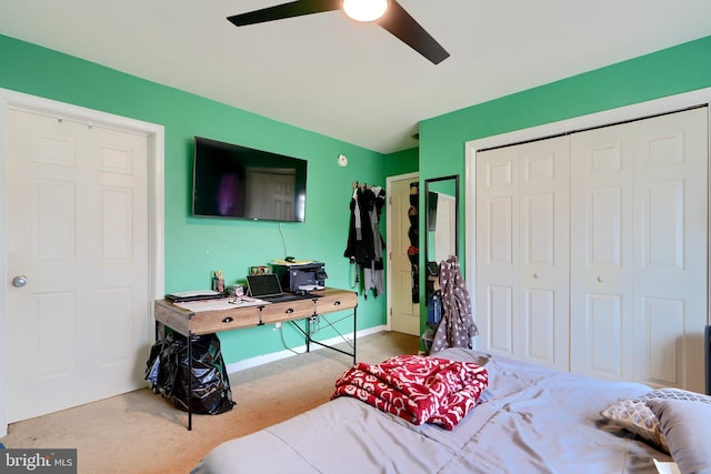 bedroom with a closet, carpet flooring, ceiling fan, and baseboards