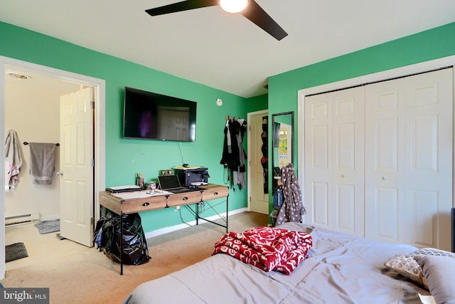 bedroom with carpet, a baseboard radiator, a closet, ceiling fan, and baseboards