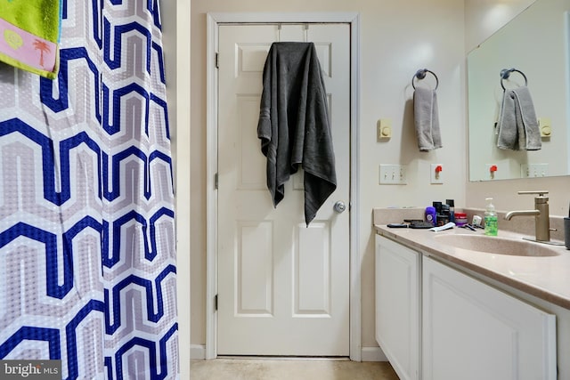 full bath featuring tile patterned flooring and vanity