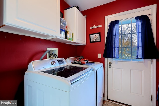 laundry room featuring washing machine and dryer and cabinet space