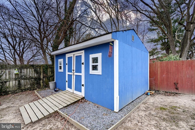 view of shed featuring a fenced backyard