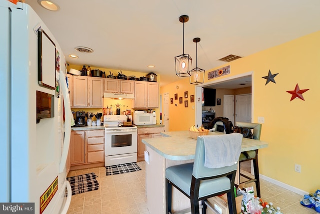 kitchen with light countertops, hanging light fixtures, visible vents, light brown cabinets, and white appliances