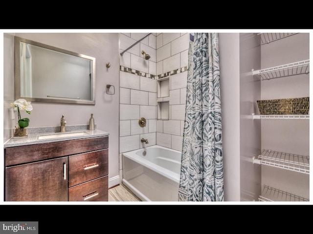 bathroom with vanity and shower / tub combo