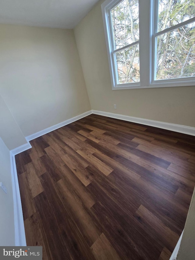 bonus room featuring dark wood-type flooring