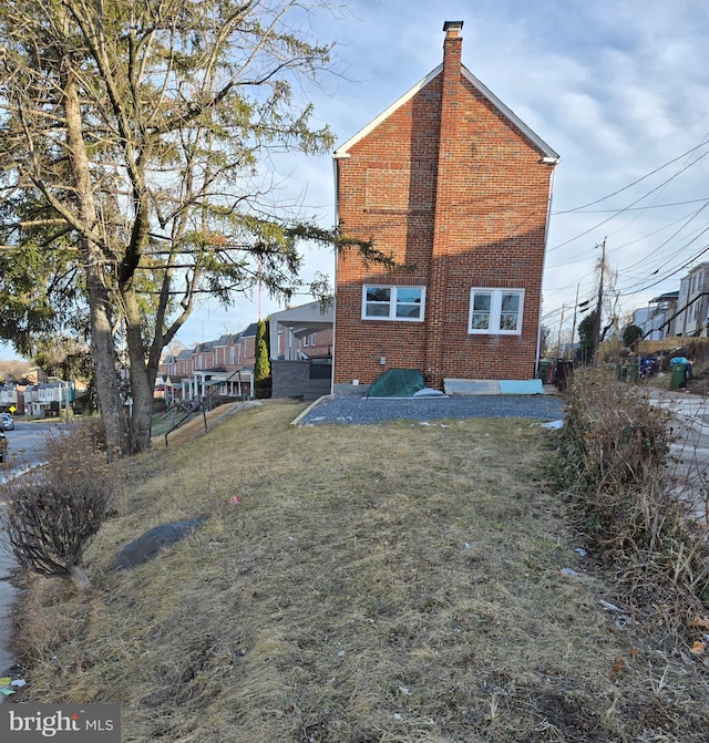 back of house with a yard