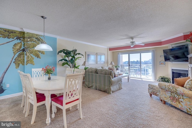 dining area featuring plenty of natural light, carpet, and crown molding