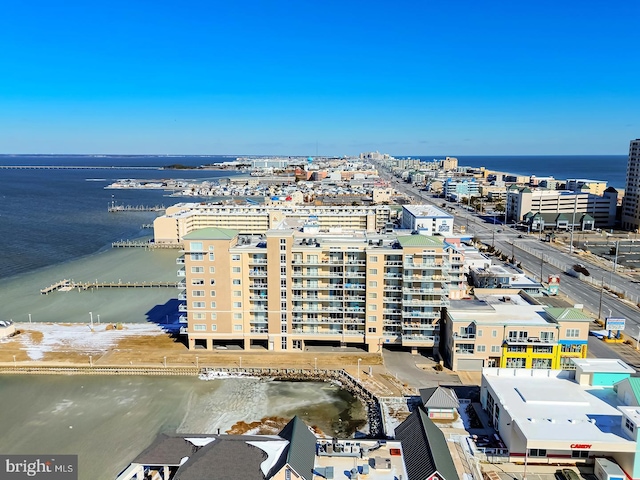 birds eye view of property featuring a water view and a city view