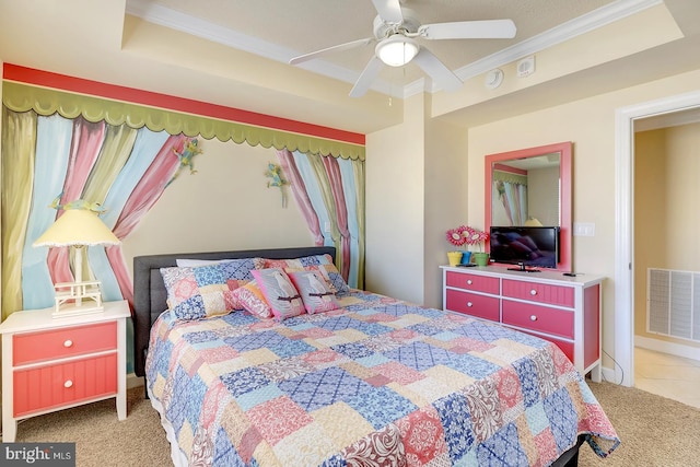 bedroom with light carpet, visible vents, a raised ceiling, a ceiling fan, and ornamental molding