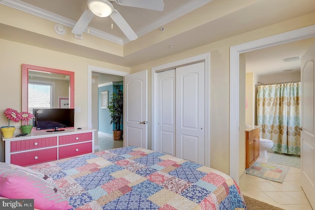 bedroom with ceiling fan, ornamental molding, a closet, and tile patterned floors