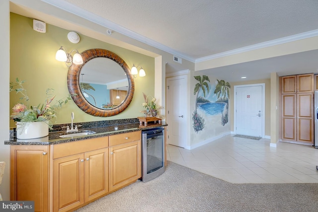 bathroom with visible vents, wine cooler, ornamental molding, tile patterned flooring, and a textured ceiling