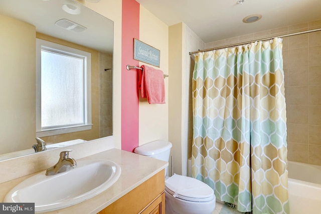 bathroom featuring toilet, shower / bathtub combination with curtain, visible vents, and vanity