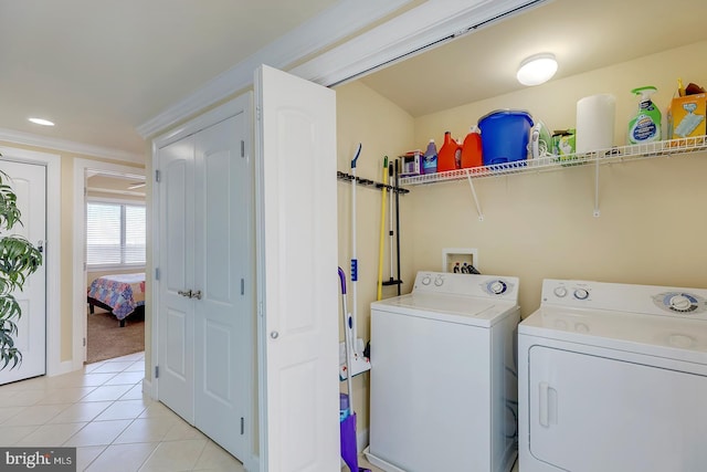 washroom featuring light tile patterned floors, laundry area, washing machine and clothes dryer, and recessed lighting