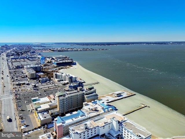 birds eye view of property with a view of city and a water view