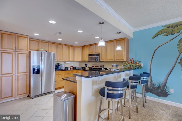 kitchen with visible vents, appliances with stainless steel finishes, decorative light fixtures, a peninsula, and crown molding