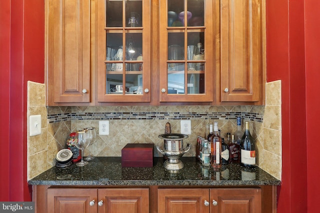 bar with a dry bar and tasteful backsplash