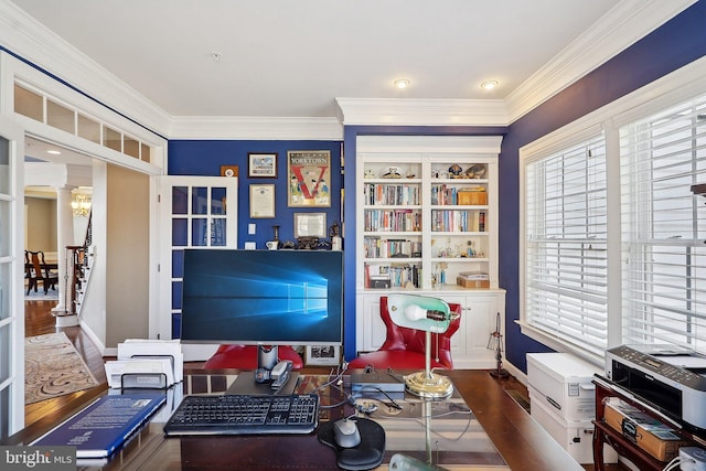 home office with baseboards, wood finished floors, and crown molding