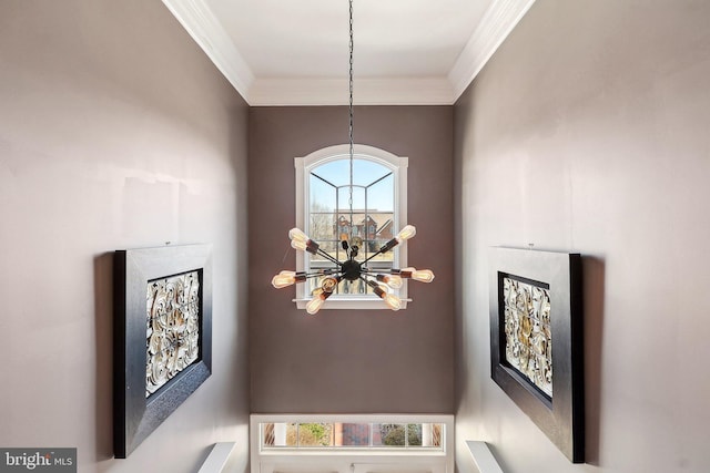 details featuring a notable chandelier and crown molding