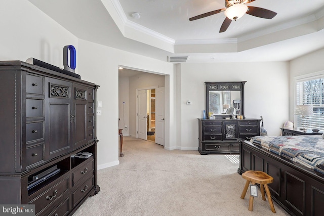 bedroom featuring ornamental molding, visible vents, a raised ceiling, and light colored carpet