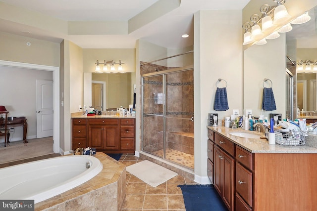 full bath with a sink, two vanities, a shower stall, a bath, and tile patterned floors