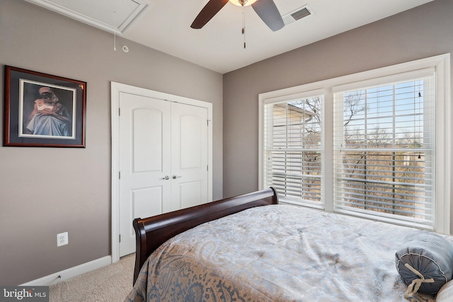 bedroom featuring attic access, visible vents, baseboards, carpet floors, and a closet