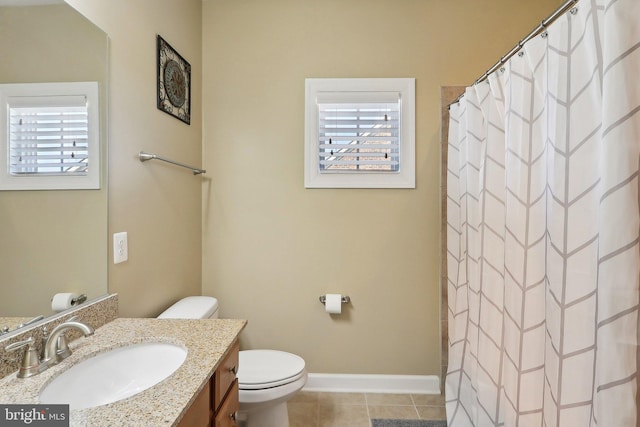 bathroom featuring baseboards, a shower with shower curtain, toilet, tile patterned floors, and vanity