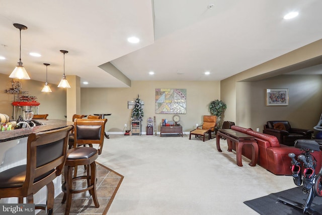 interior space featuring carpet floors, recessed lighting, and decorative light fixtures