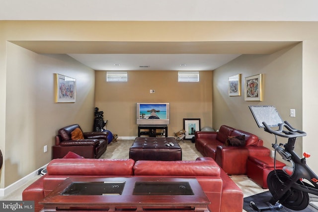 carpeted living room featuring visible vents and baseboards