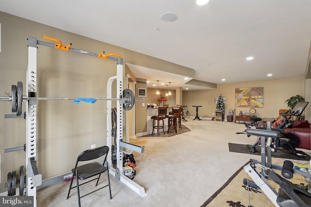 workout room with carpet floors and recessed lighting