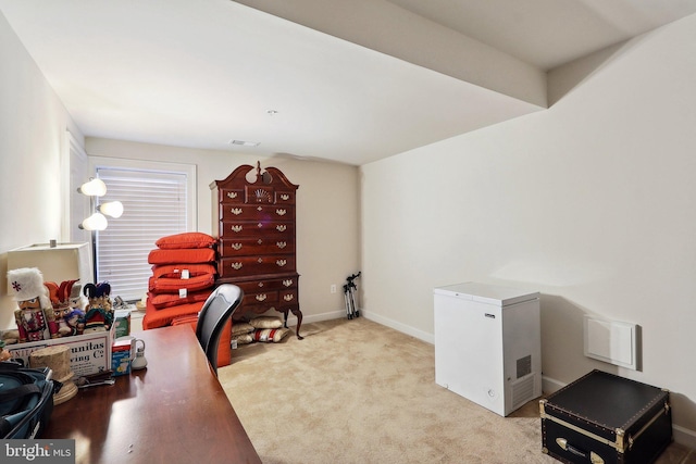 carpeted office with baseboards and visible vents