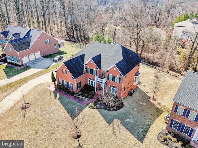 aerial view featuring a wooded view