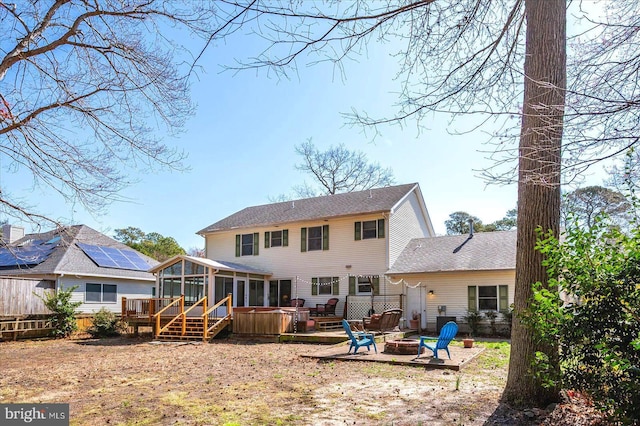 10133 Queens Cir, Ocean City, MD 21842 - rear view of property featuring a fire pit, roof with shingles, fence, a deck, and a sunroom