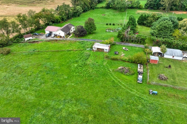 birds eye view of property with a rural view