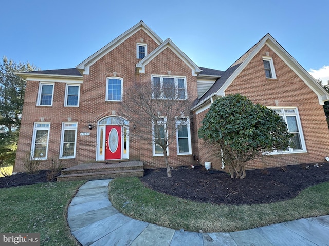 view of front of home with brick siding