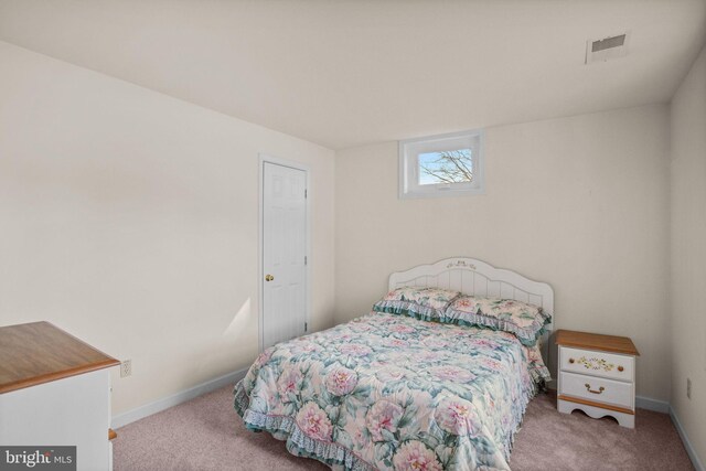 bedroom featuring visible vents, baseboards, and carpet flooring