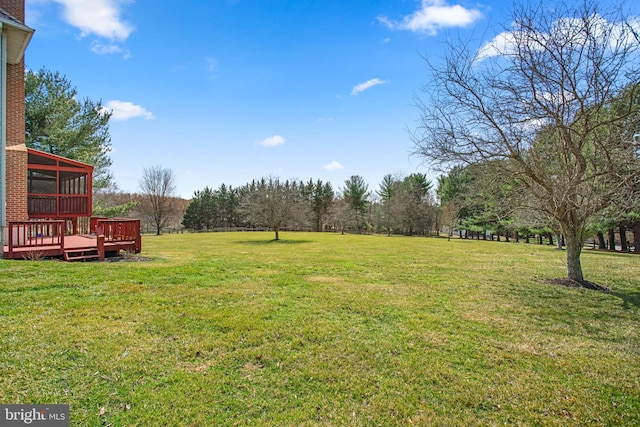 view of yard with a wooden deck