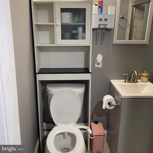 bathroom with toilet and vanity