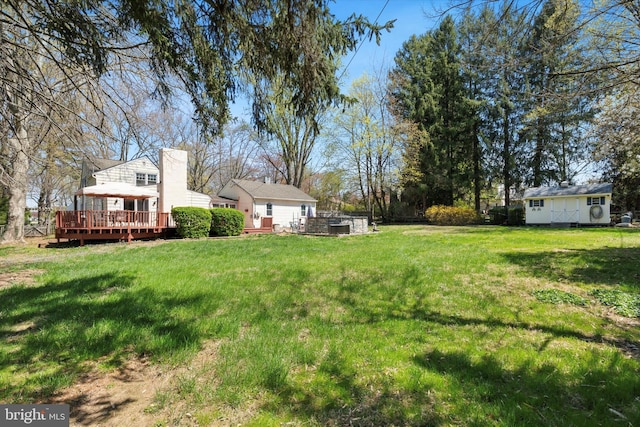 view of yard with a wooden deck