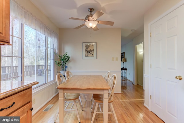 dining area featuring ceiling fan, plenty of natural light, and light hardwood / wood-style flooring