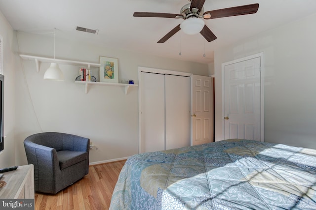 bedroom featuring ceiling fan and light hardwood / wood-style flooring