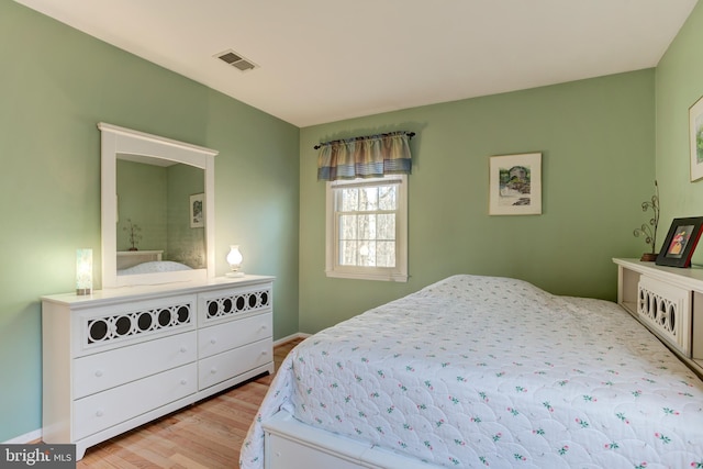 bedroom with light wood-type flooring