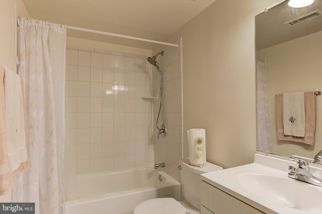 full bathroom with shower / bath combo with shower curtain, vanity, and toilet