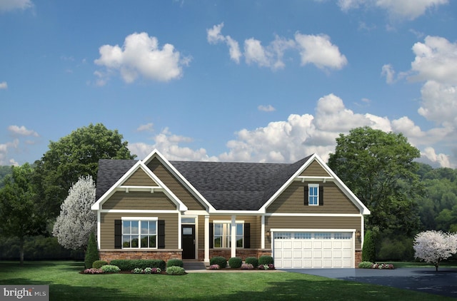 craftsman-style house featuring a garage and a front lawn