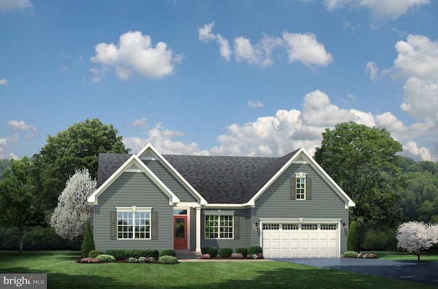 view of front of house featuring a garage and a front yard