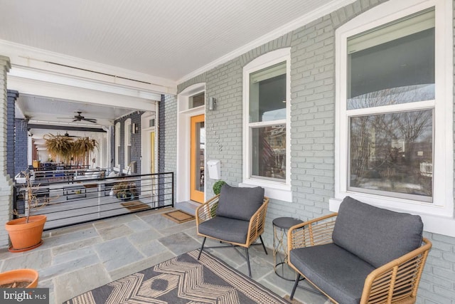 view of patio featuring ceiling fan and covered porch