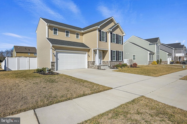 view of front of property with a garage and a front lawn