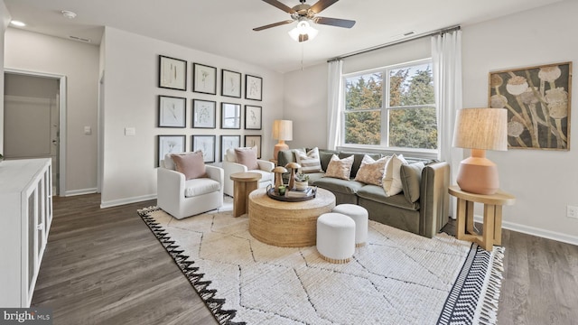 living room with hardwood / wood-style floors and ceiling fan